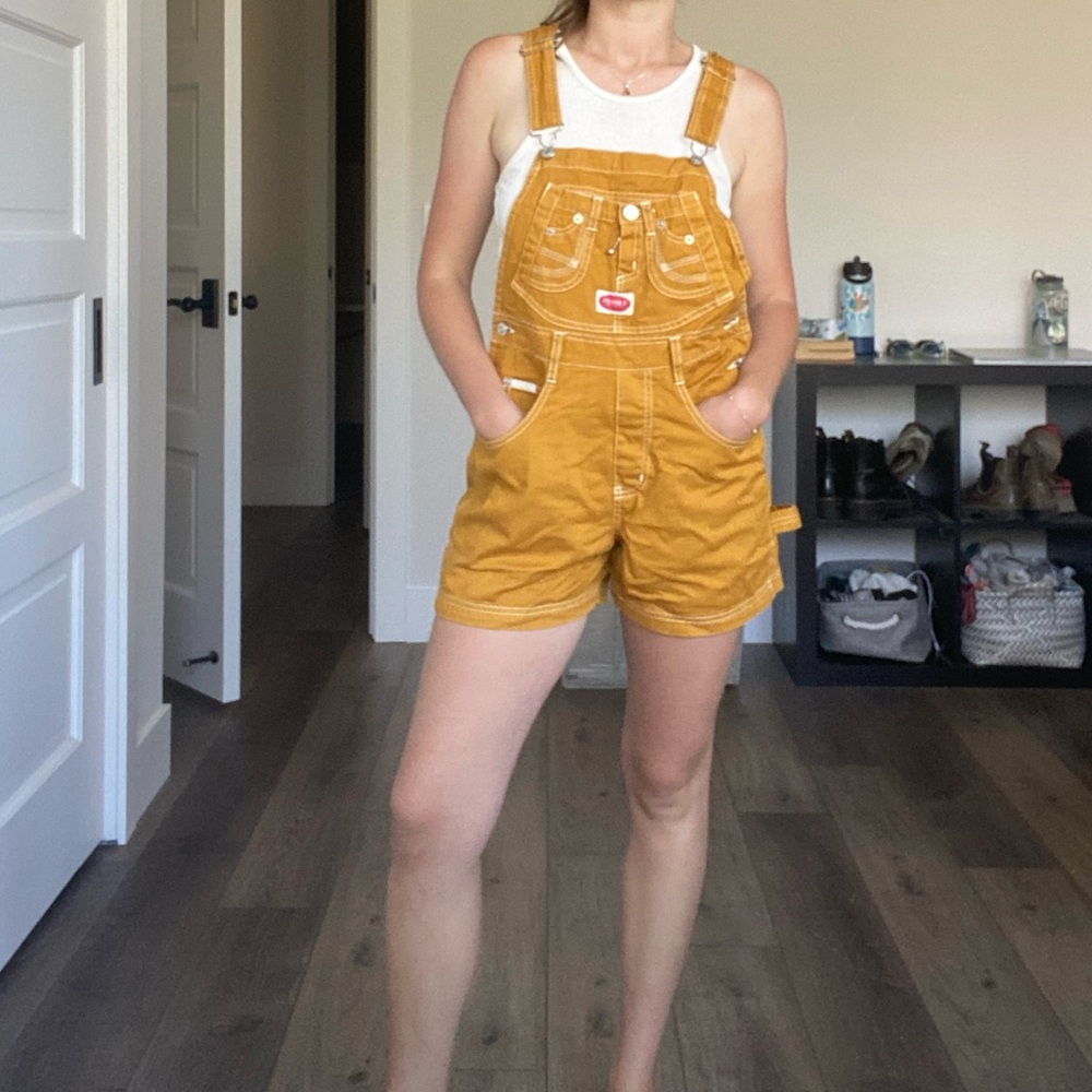 revolt gold overalls